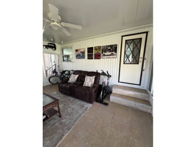 This well maintained and beautifully furnished home, in active on Lake Henry Golf Club in Florida - for sale on GolfHomes.com, golf home, golf lot