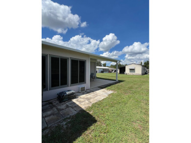 This well maintained and beautifully furnished home, in active on Lake Henry Golf Club in Florida - for sale on GolfHomes.com, golf home, golf lot