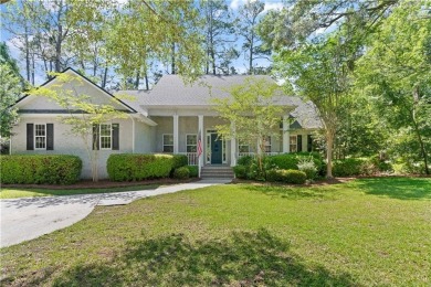 Tucked behind a canopy of mature trees, this beautifully on Oak Grove Island Golf and Country Club in Georgia - for sale on GolfHomes.com, golf home, golf lot
