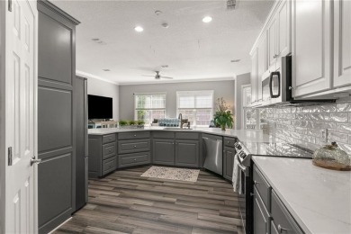 Tucked behind a canopy of mature trees, this beautifully on Oak Grove Island Golf and Country Club in Georgia - for sale on GolfHomes.com, golf home, golf lot