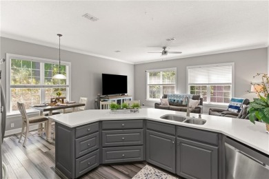 Tucked behind a canopy of mature trees, this beautifully on Oak Grove Island Golf and Country Club in Georgia - for sale on GolfHomes.com, golf home, golf lot