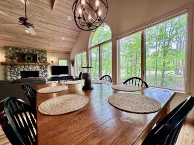 Step into this immaculate custom home, perfectly situated with on Michaywe Pines Course in Michigan - for sale on GolfHomes.com, golf home, golf lot