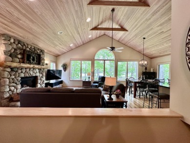 Step into this immaculate custom home, perfectly situated with on Michaywe Pines Course in Michigan - for sale on GolfHomes.com, golf home, golf lot