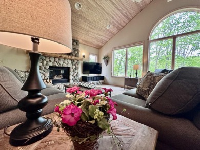 Step into this immaculate custom home, perfectly situated with on Michaywe Pines Course in Michigan - for sale on GolfHomes.com, golf home, golf lot