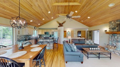 Step into this immaculate custom home, perfectly situated with on Michaywe Pines Course in Michigan - for sale on GolfHomes.com, golf home, golf lot