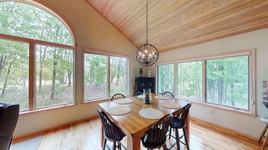 Step into this immaculate custom home, perfectly situated with on Michaywe Pines Course in Michigan - for sale on GolfHomes.com, golf home, golf lot