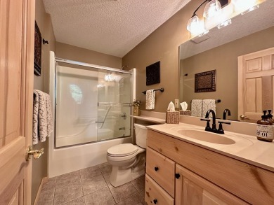 Step into this immaculate custom home, perfectly situated with on Michaywe Pines Course in Michigan - for sale on GolfHomes.com, golf home, golf lot