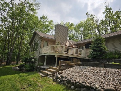 Step into this immaculate custom home, perfectly situated with on Michaywe Pines Course in Michigan - for sale on GolfHomes.com, golf home, golf lot