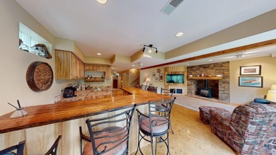 Step into this immaculate custom home, perfectly situated with on Michaywe Pines Course in Michigan - for sale on GolfHomes.com, golf home, golf lot