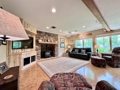 Step into this immaculate custom home, perfectly situated with on Michaywe Pines Course in Michigan - for sale on GolfHomes.com, golf home, golf lot