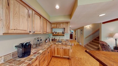 Step into this immaculate custom home, perfectly situated with on Michaywe Pines Course in Michigan - for sale on GolfHomes.com, golf home, golf lot