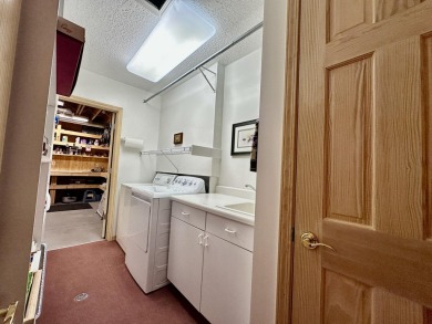 Step into this immaculate custom home, perfectly situated with on Michaywe Pines Course in Michigan - for sale on GolfHomes.com, golf home, golf lot