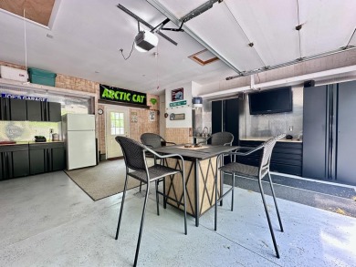 Step into this immaculate custom home, perfectly situated with on Michaywe Pines Course in Michigan - for sale on GolfHomes.com, golf home, golf lot