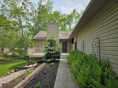 Step into this immaculate custom home, perfectly situated with on Michaywe Pines Course in Michigan - for sale on GolfHomes.com, golf home, golf lot