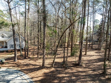 Discover the perfect setting to build your custom dream home in on River Landing Golf Course in North Carolina - for sale on GolfHomes.com, golf home, golf lot