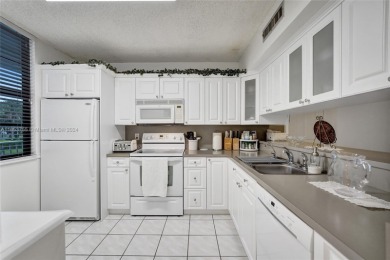 Welcome to this TOTALLY REMODELED condo located in an all-age on Pine Island Ridge Country Club in Florida - for sale on GolfHomes.com, golf home, golf lot