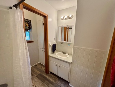 NEW LISTING!! This residence offers diverse possibilities on Cherokee Village South Course in Arkansas - for sale on GolfHomes.com, golf home, golf lot