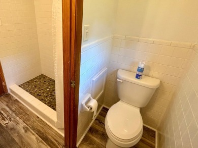 NEW LISTING!! This residence offers diverse possibilities on Cherokee Village South Course in Arkansas - for sale on GolfHomes.com, golf home, golf lot