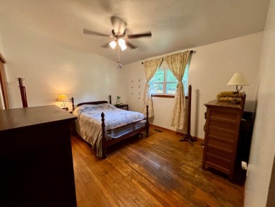 NEW LISTING!! This residence offers diverse possibilities on Cherokee Village South Course in Arkansas - for sale on GolfHomes.com, golf home, golf lot