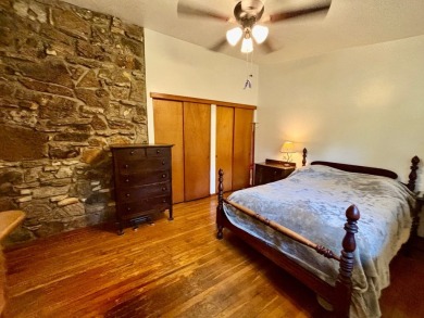 NEW LISTING!! This residence offers diverse possibilities on Cherokee Village South Course in Arkansas - for sale on GolfHomes.com, golf home, golf lot
