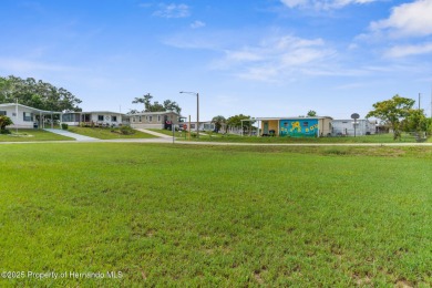 Beautifully Updated 3-Bedroom, 2-Bath Home with An EXTRA Lot on High Point Golf Club, Inc. in Florida - for sale on GolfHomes.com, golf home, golf lot