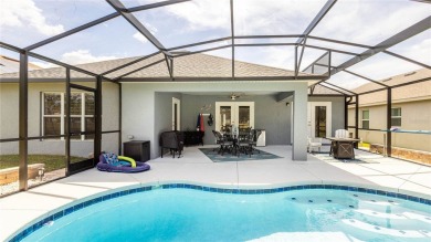 Welcome to this STUNNING POOL HOME situated on the 10th hole of on Arlington Ridge Golf Club in Florida - for sale on GolfHomes.com, golf home, golf lot