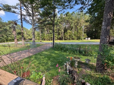 NEW LISTING!! This residence offers diverse possibilities on Cherokee Village South Course in Arkansas - for sale on GolfHomes.com, golf home, golf lot