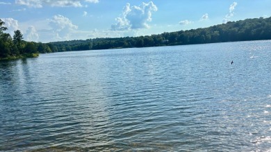 NEW LISTING!! This residence offers diverse possibilities on Cherokee Village South Course in Arkansas - for sale on GolfHomes.com, golf home, golf lot