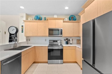 This beautifully renovated 1st-floor villa with golf course on Santa Lucia River Club in Florida - for sale on GolfHomes.com, golf home, golf lot