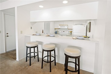 Enjoy resort-style living in this bright 2nd-floor corner unit on Vista Plantation Golf Club in Florida - for sale on GolfHomes.com, golf home, golf lot