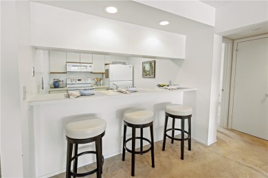 Enjoy resort-style living in this bright 2nd-floor corner unit on Vista Plantation Golf Club in Florida - for sale on GolfHomes.com, golf home, golf lot