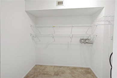 Enjoy resort-style living in this bright 2nd-floor corner unit on Vista Plantation Golf Club in Florida - for sale on GolfHomes.com, golf home, golf lot