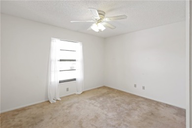 Enjoy resort-style living in this bright 2nd-floor corner unit on Vista Plantation Golf Club in Florida - for sale on GolfHomes.com, golf home, golf lot