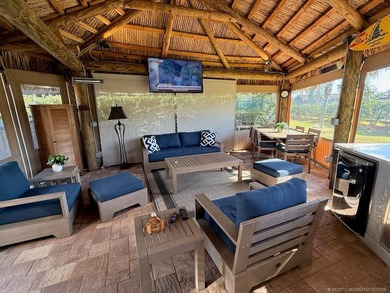 A SPORT LOVER'S DREAM WITH PRIVACY AND COMFORT! Perfectly on St. Lucie Trail Golf Club in Florida - for sale on GolfHomes.com, golf home, golf lot