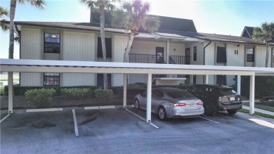 Enjoy resort-style living in this bright 2nd-floor corner unit on Vista Plantation Golf Club in Florida - for sale on GolfHomes.com, golf home, golf lot
