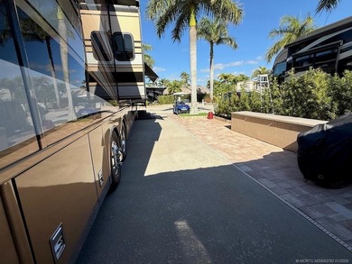 A SPORT LOVER'S DREAM WITH PRIVACY AND COMFORT! Perfectly on St. Lucie Trail Golf Club in Florida - for sale on GolfHomes.com, golf home, golf lot