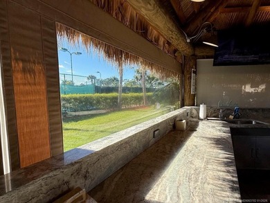 A SPORT LOVER'S DREAM WITH PRIVACY AND COMFORT! Perfectly on St. Lucie Trail Golf Club in Florida - for sale on GolfHomes.com, golf home, golf lot