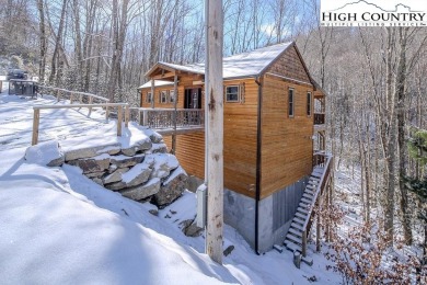 This charming Creekside cabin offers the perfect blend of on Beech Mountain Club in North Carolina - for sale on GolfHomes.com, golf home, golf lot