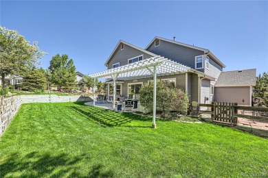 Nestled on a corner lot in a serene cul-de-sac within the on Red Hawk Ridge in Colorado - for sale on GolfHomes.com, golf home, golf lot