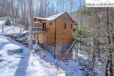 This charming Creekside cabin offers the perfect blend of on Beech Mountain Club in North Carolina - for sale on GolfHomes.com, golf home, golf lot