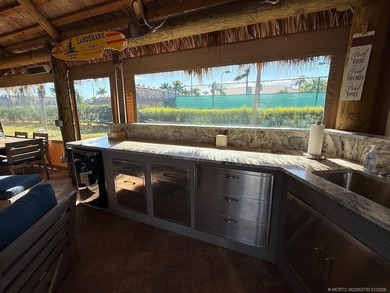 A SPORT LOVER'S DREAM WITH PRIVACY AND COMFORT! Perfectly on St. Lucie Trail Golf Club in Florida - for sale on GolfHomes.com, golf home, golf lot