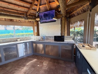 A SPORT LOVER'S DREAM WITH PRIVACY AND COMFORT! Perfectly on St. Lucie Trail Golf Club in Florida - for sale on GolfHomes.com, golf home, golf lot