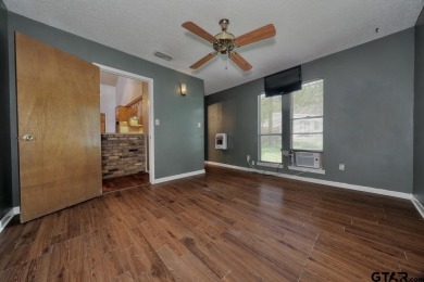 Step inside this charming single-story cottage and discover the on Hide-A-Way Lake Golf Course in Texas - for sale on GolfHomes.com, golf home, golf lot