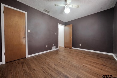 Step inside this charming single-story cottage and discover the on Hide-A-Way Lake Golf Course in Texas - for sale on GolfHomes.com, golf home, golf lot