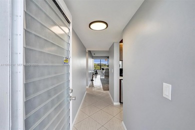 Move-in ready top-floor 2-bedroom, 2-bath condo with no on Pine Island Ridge Country Club in Florida - for sale on GolfHomes.com, golf home, golf lot