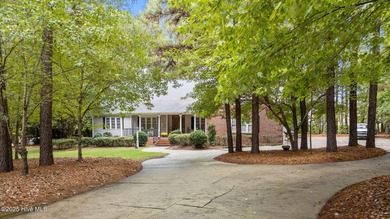 Situated on a corner lot and nestled on 1.29 wooded acres in the on The Neuse Golf Club in North Carolina - for sale on GolfHomes.com, golf home, golf lot