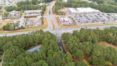 Situated on a corner lot and nestled on 1.29 wooded acres in the on The Neuse Golf Club in North Carolina - for sale on GolfHomes.com, golf home, golf lot