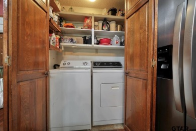 Step inside this charming single-story cottage and discover the on Hide-A-Way Lake Golf Course in Texas - for sale on GolfHomes.com, golf home, golf lot