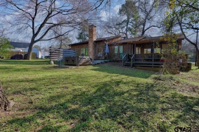 Step inside this charming single-story cottage and discover the on Hide-A-Way Lake Golf Course in Texas - for sale on GolfHomes.com, golf home, golf lot