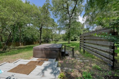 Step inside this charming single-story cottage and discover the on Hide-A-Way Lake Golf Course in Texas - for sale on GolfHomes.com, golf home, golf lot